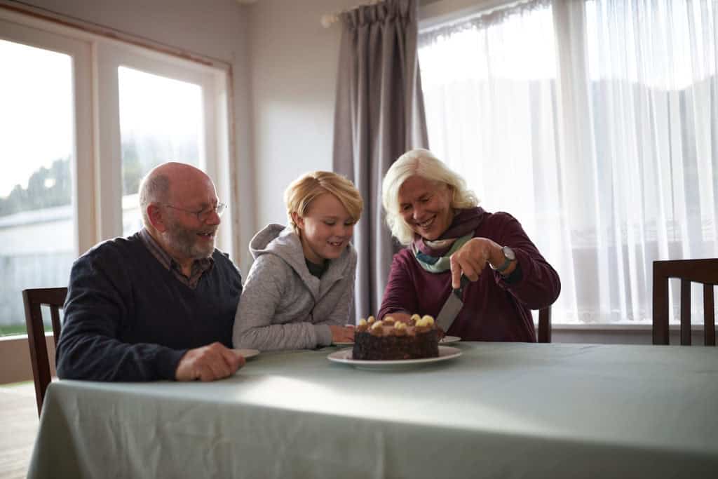 Grandparents and grandchild enjoying a warm home